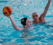 Sophomore Luke Oliver looks for an open teammate while a Clayton defender prepares to block the pass. The Colts' varsity water polo team was defeated by a score of 15-5. Photo by: Tara Stepanek