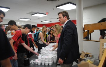 Principal Mr. Tim McCarthy surprises students at both lunches with free ice cream. The administration wanted to show their appreciation of the students' cooperation during EOCs and other testing. Photo by Meaghan Flynn.