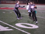 Senior Jessica Brady blocks junior Rebecca Poscover from getting the football from Bain, who was running back for the senior team. Photo courtesy of the PCH Corral. 
