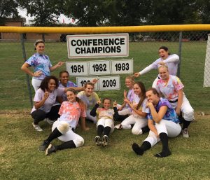 The members of the softball team celebrate after winning the 2016 Conference Championship Sept. 29 on their home field. Photo courtesy of Emily West