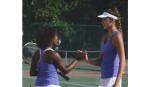 Senior Bianca Gavaller and her teammate shake hands after playing. Gavaller has played tennis for 6 years  and has played for North's team since her freshman year. 