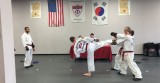 Jacob Shepherd performs his board break during belt testing. "I enjoy being able to work on a certain technique and make it better," says Shepherd about the sport. "I also enjoy sparring other people."